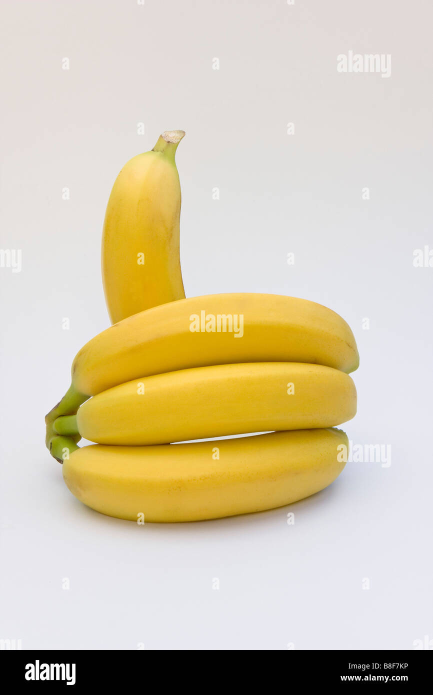 Bunch of bananas on white background making a 'thumbs up' gesture with space around subject for copy or graphic Stock Photo