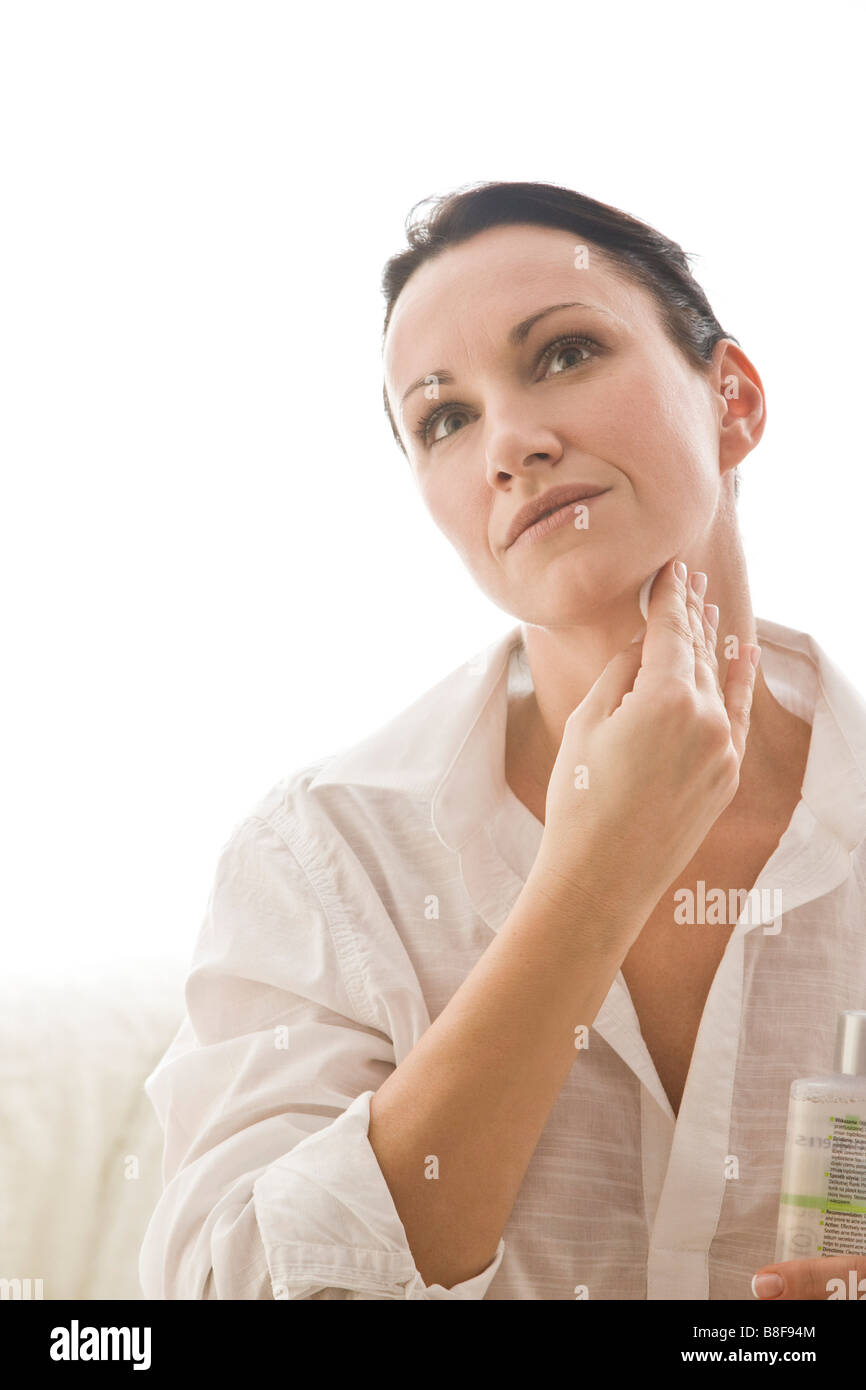 woman cleaning face with tonic Stock Photo