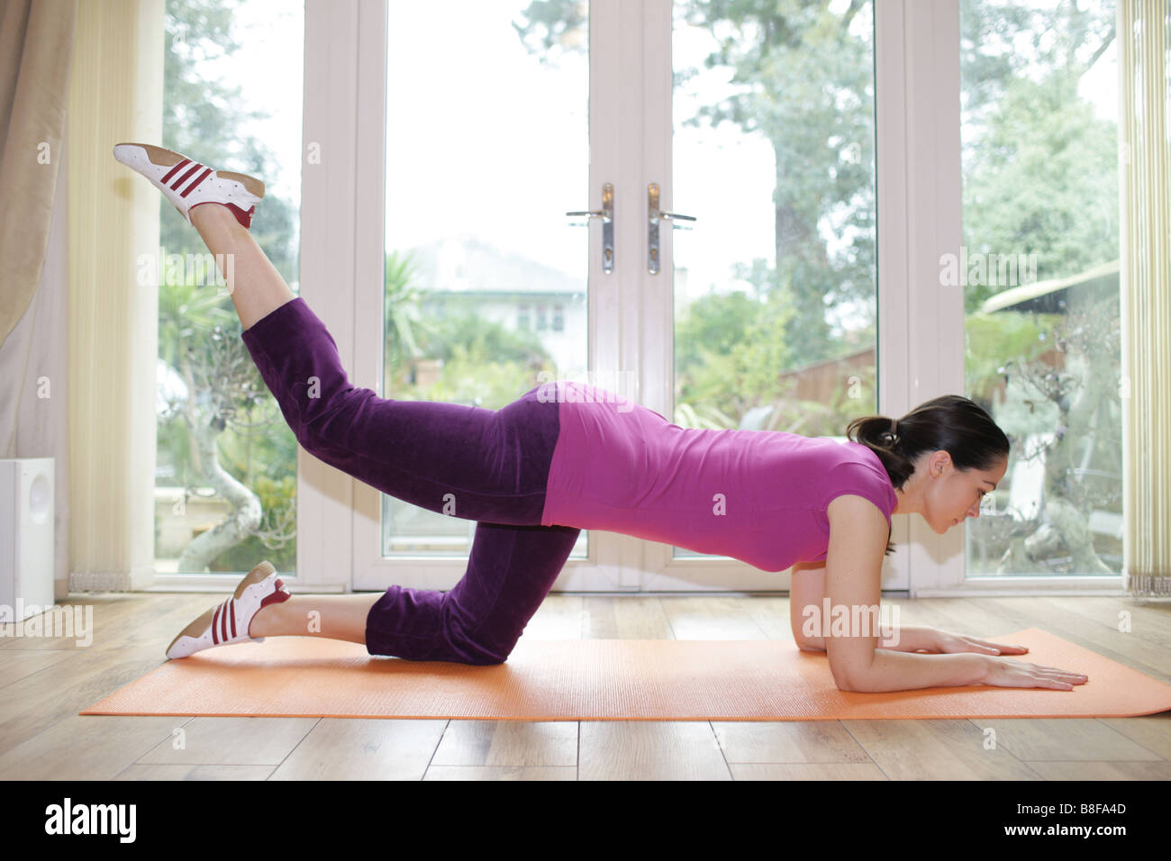 Young Woman Doing Donkey Kicks Model Released Stock Photo