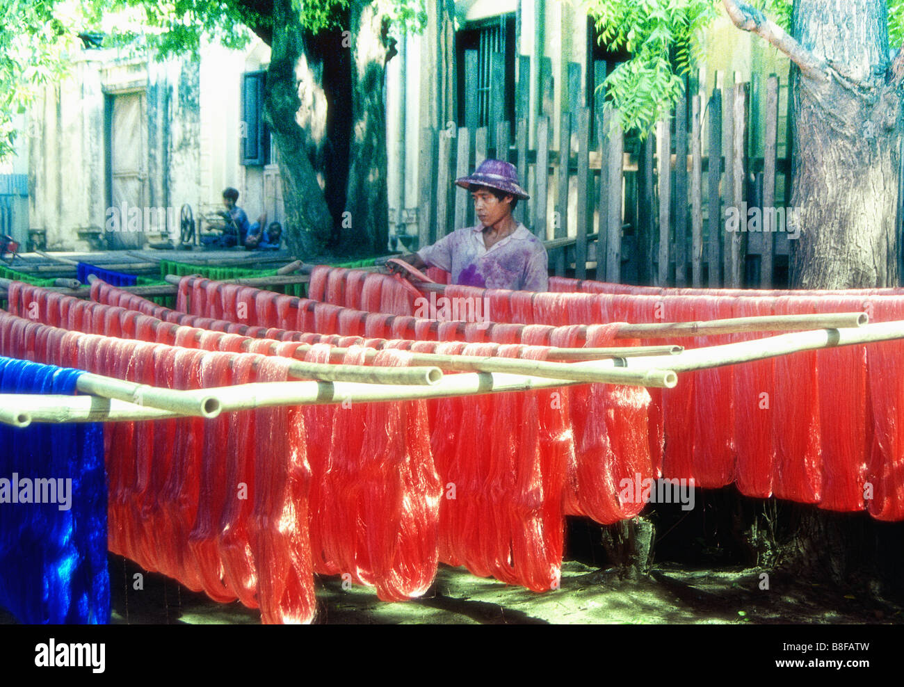 A silk spinning and dyeing factory near Mandalay, Myanmar Stock Photo