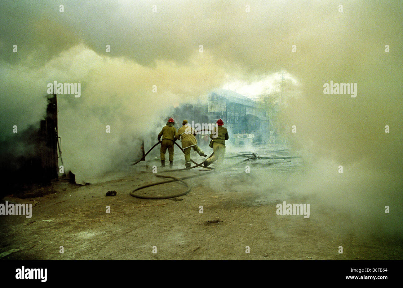 firefighter at work are trying to extinguish a fire at a Bucharest ...