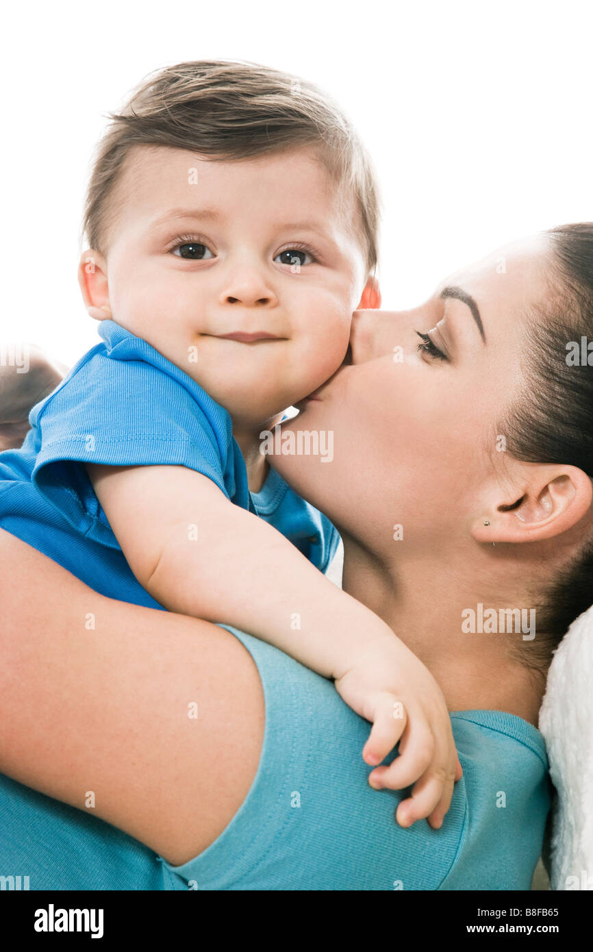 mother kissing baby boy Stock Photo