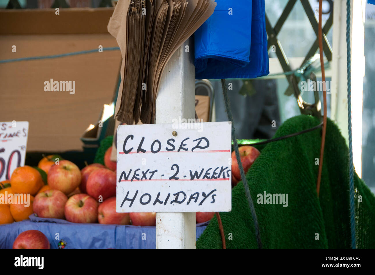 Hackney East London Broadway market Fruit and vegetable stall with sign