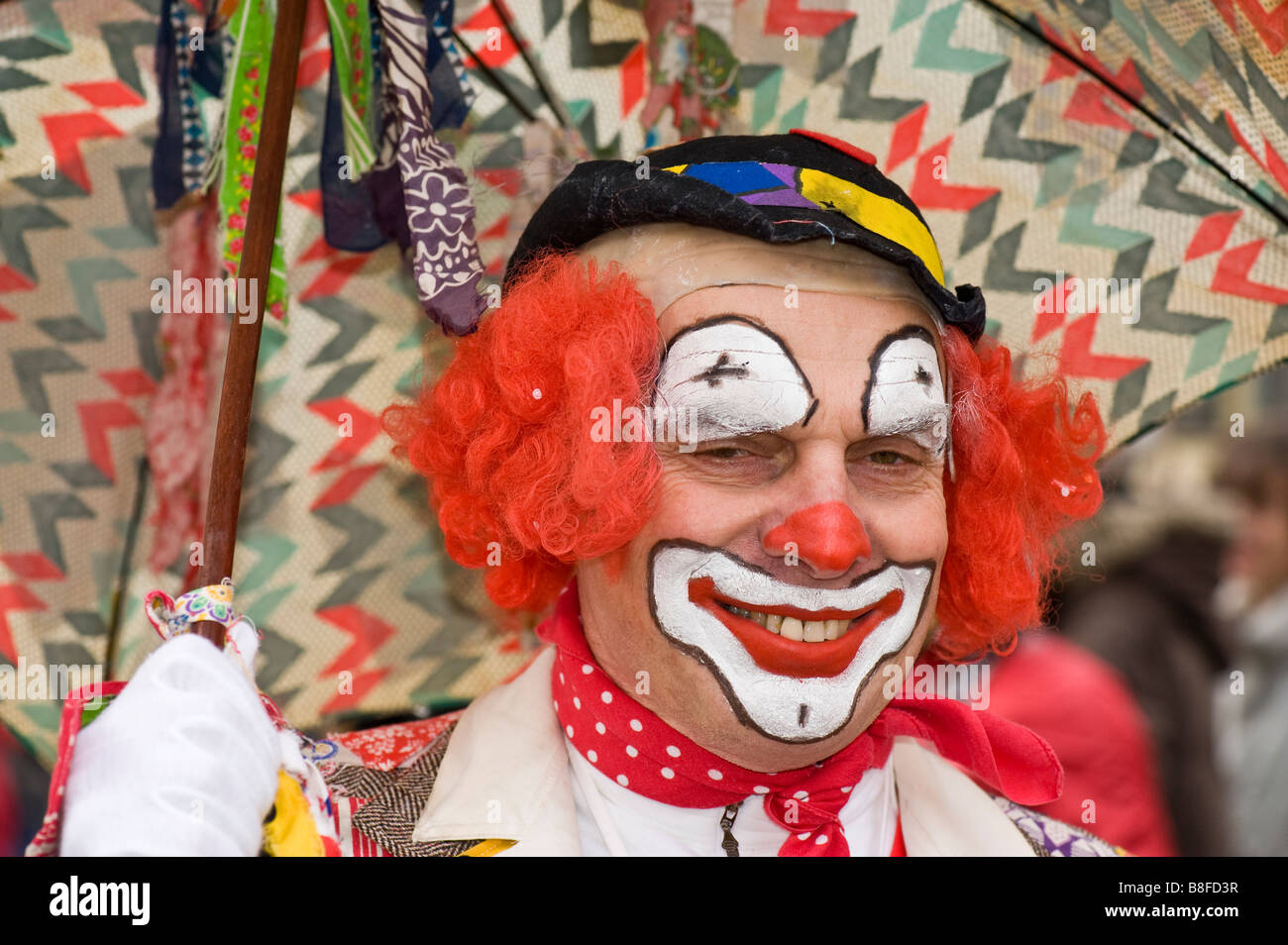 Fool in his costume with umbrella during carnival in Germany Stock Photo