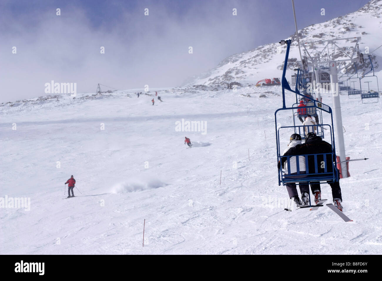 Skiers on ski lift High Tatras Skalnate pleso, Slovakia Stock Photo