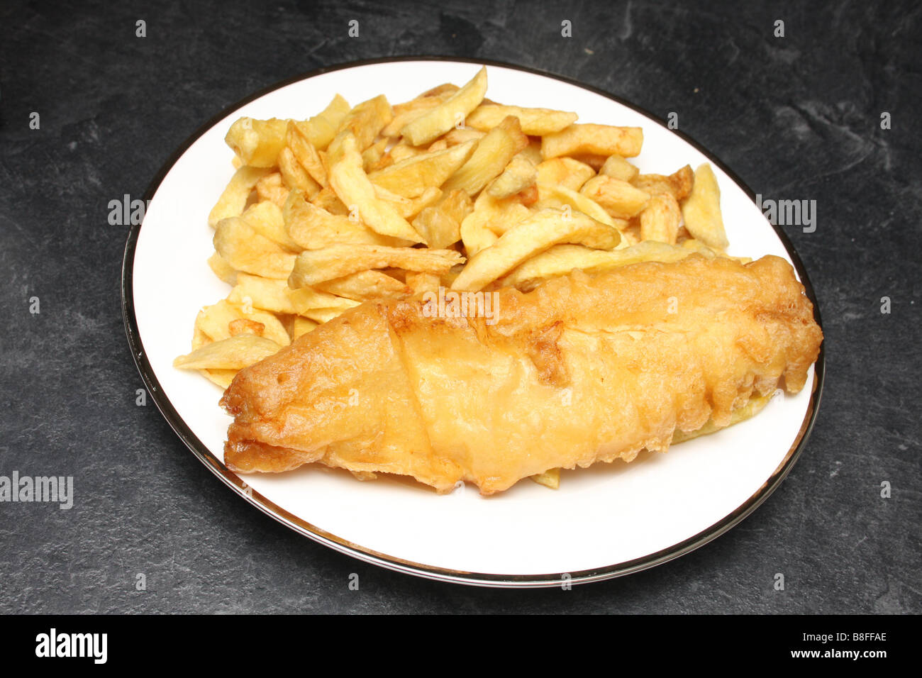 Fish and chips from a chip shop. Stock Photo