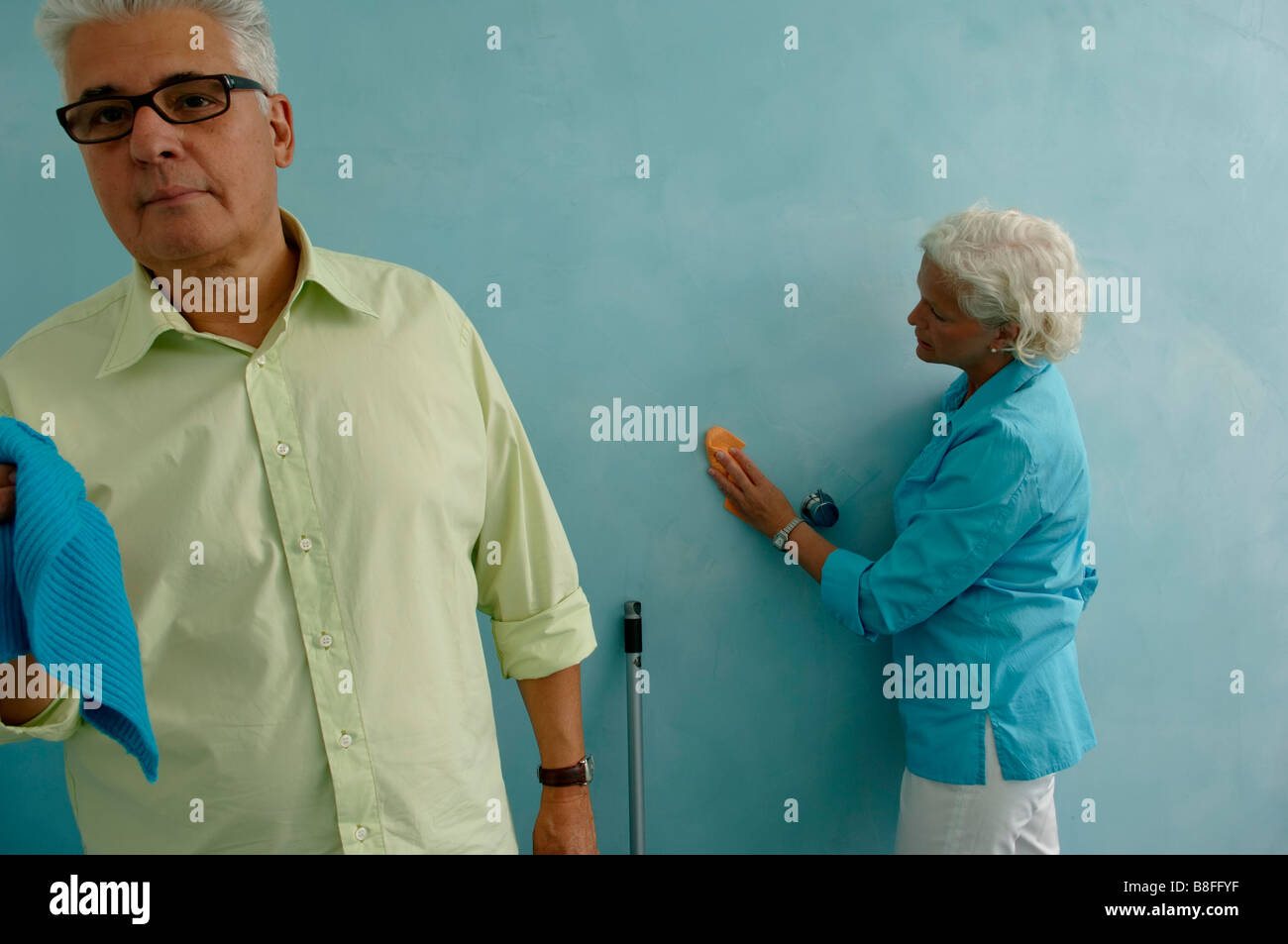 Senior man cleaning eyeglasses hi-res stock photography and images - Alamy
