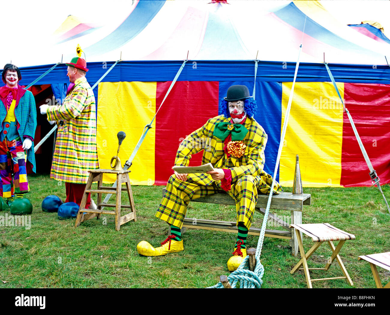 Clowns in front of circus tent Stock Photo