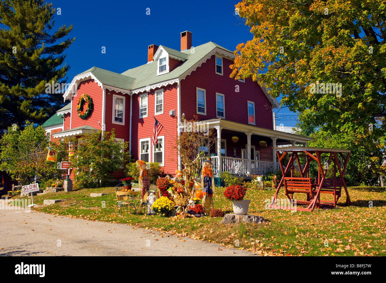 Autumn Yard Decor With Pumpkins Corn Stalks And Scarecrows At The