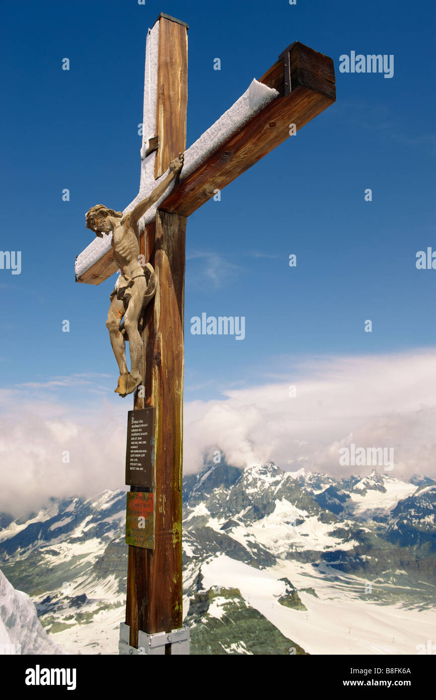 Crucifix on the peak of The little Matterhorn , Stock Photo