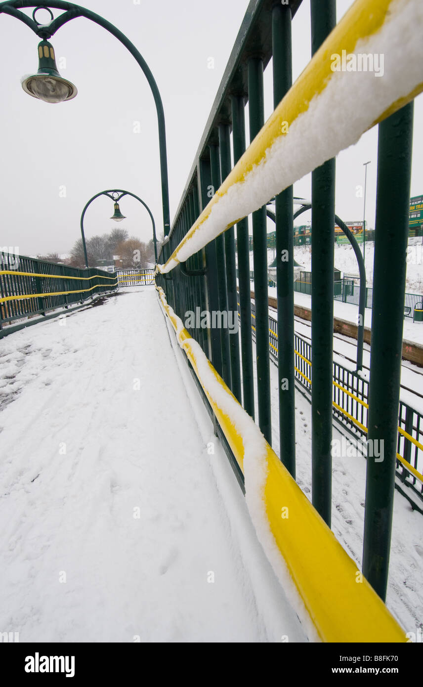 Snow On Rails Hand rails of a railway footbridge covered in snow Stock Photo - Alamy