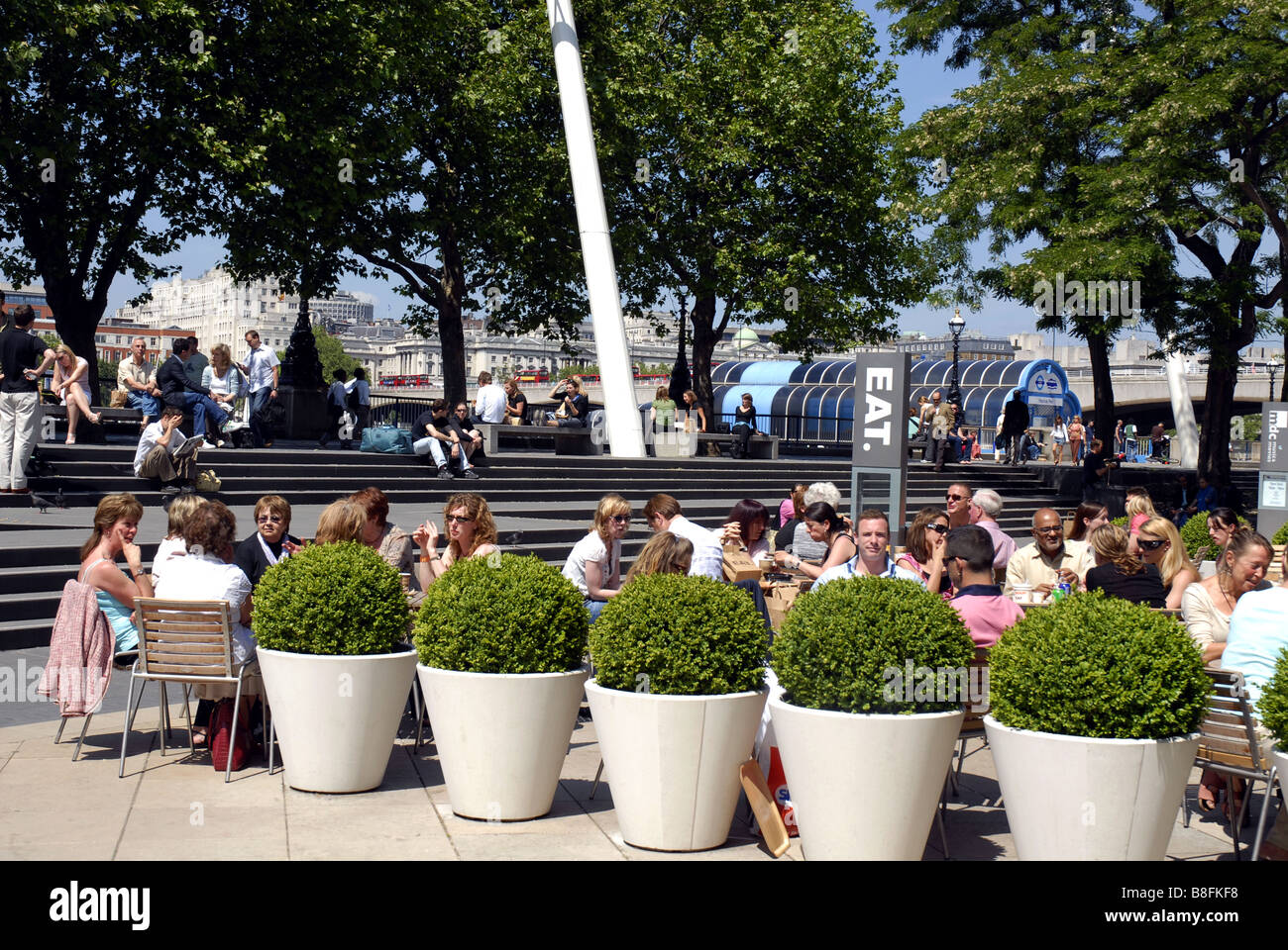 Tourists enjoying the summer in a retaurant on the South Bank, London Stock Photo