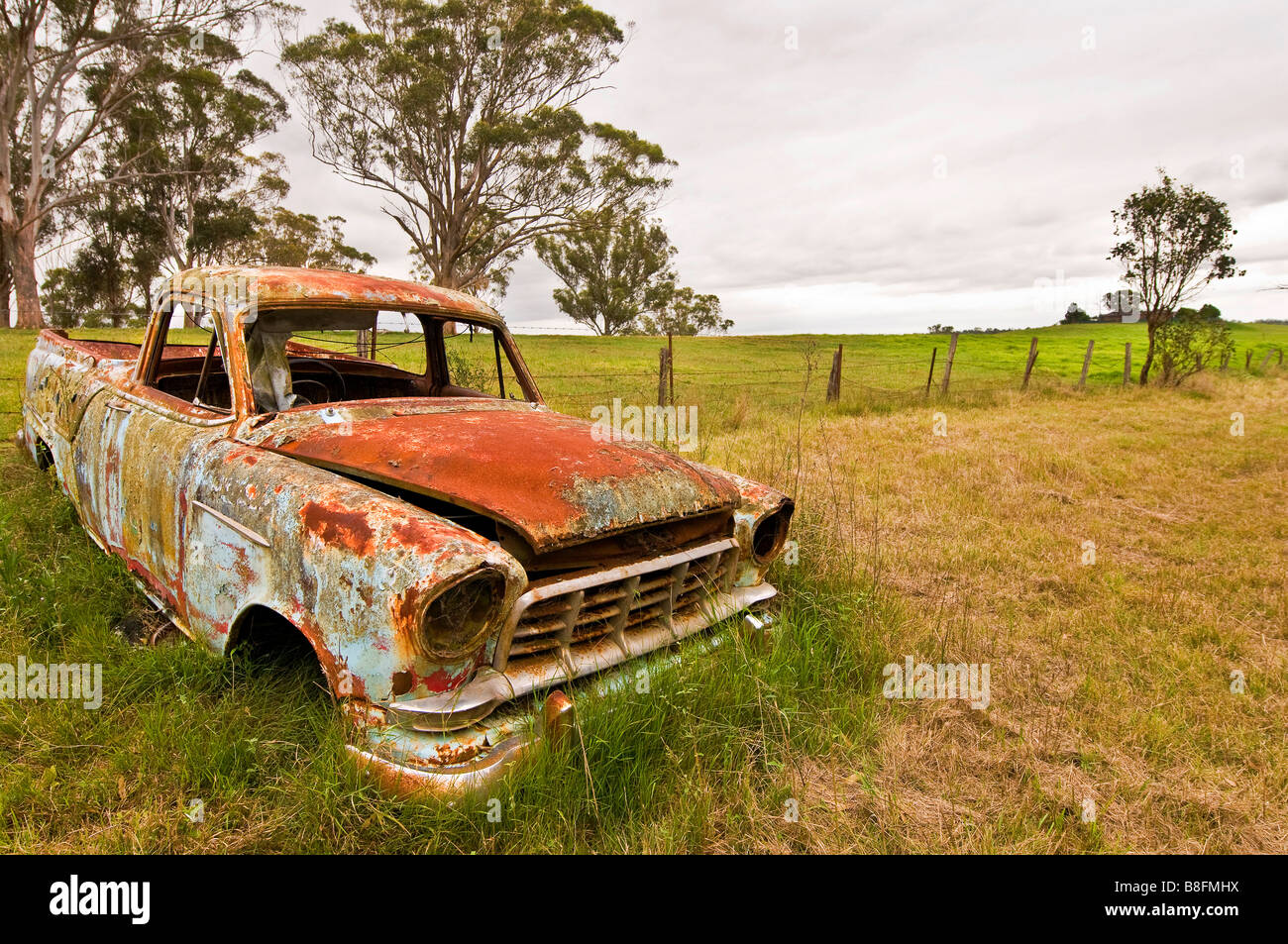 A Holden Bringelly Bush Fire Brigade engine rusts away in a forelorn pasture close to Liverpool in Sydney Australia Stock Photo