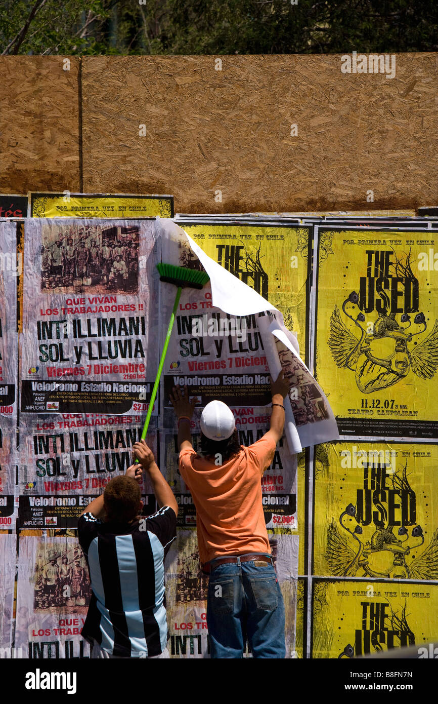 Putting up posters in Bellavista Santiago Chile Stock Photo Alamy