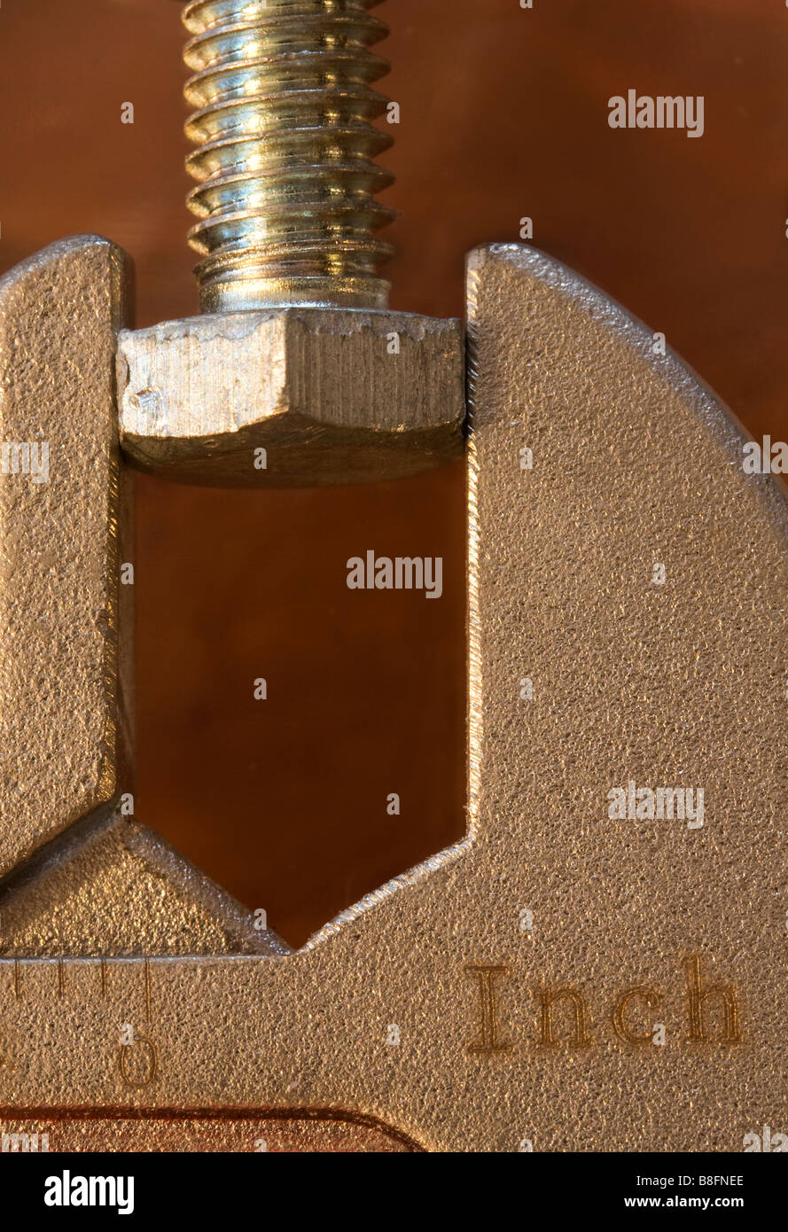 An adjustable wrench holding a bolt Stock Photo Alamy