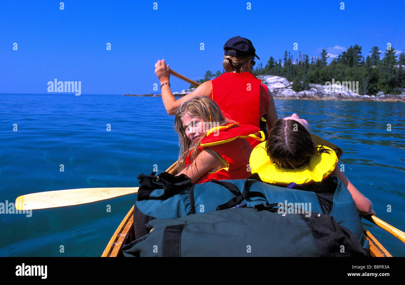 Family canoe tripping on lake superior Stock Photo Alamy
