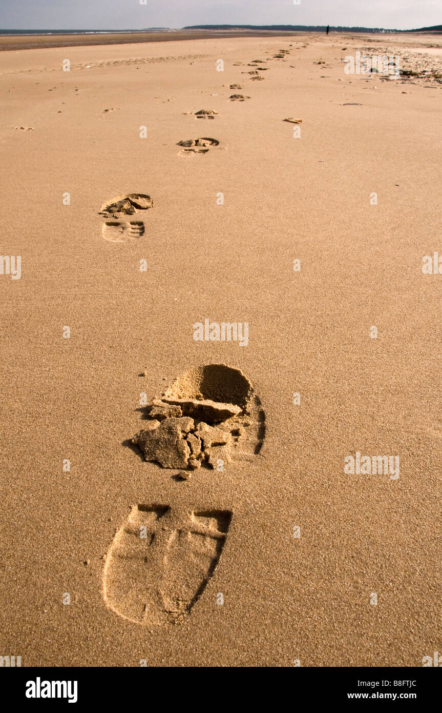 Bootprints in sand, Holkam Bay, Norfolk, England, UK Stock Photo