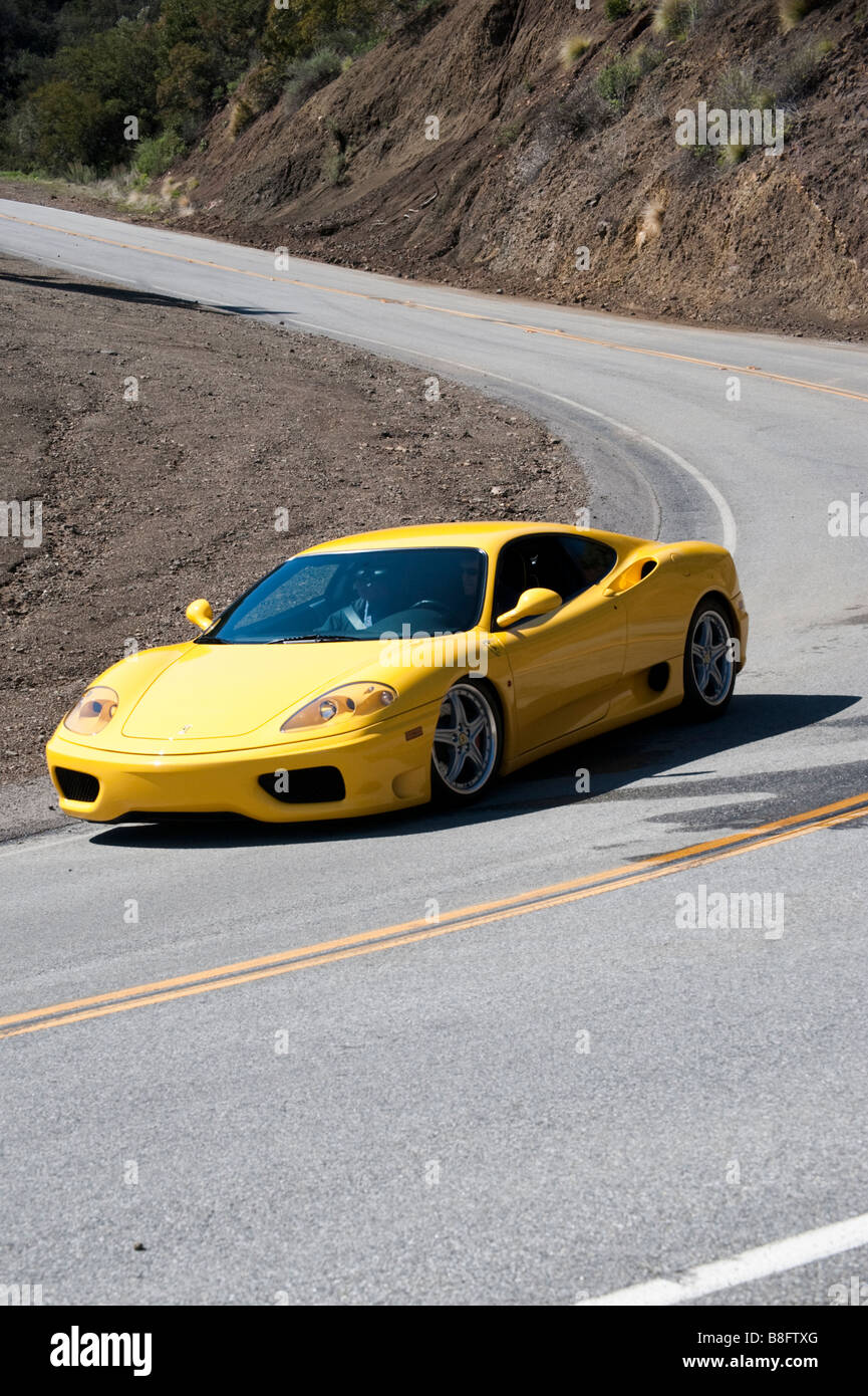 Yellow Ferrari on Mulholland Highway in Southern California Stock Photo