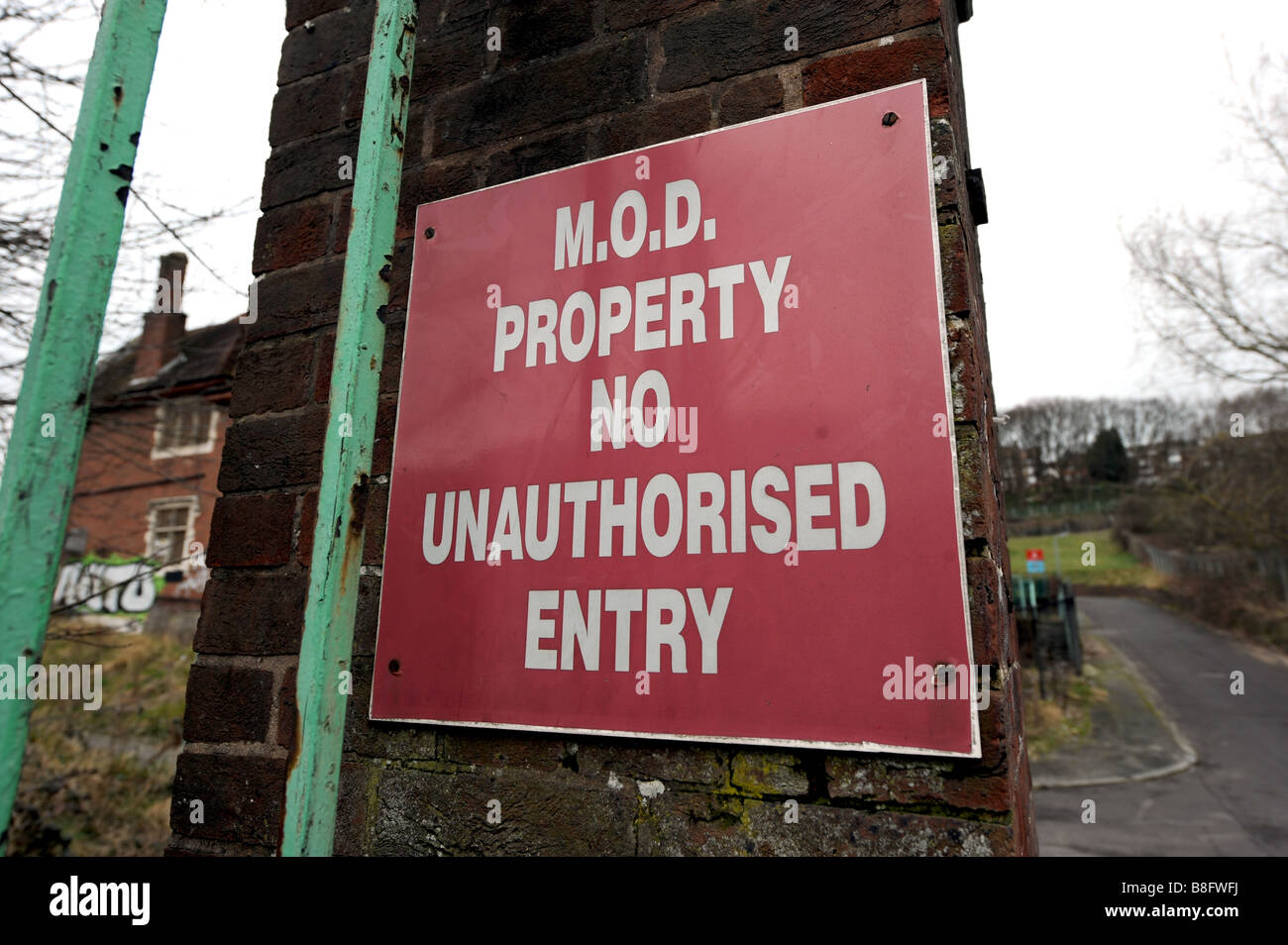 OLD M.O.D sign on wasteland around the derelict Preston Barracks site in Lewes Road Brighton which is due for regeneration Stock Photo