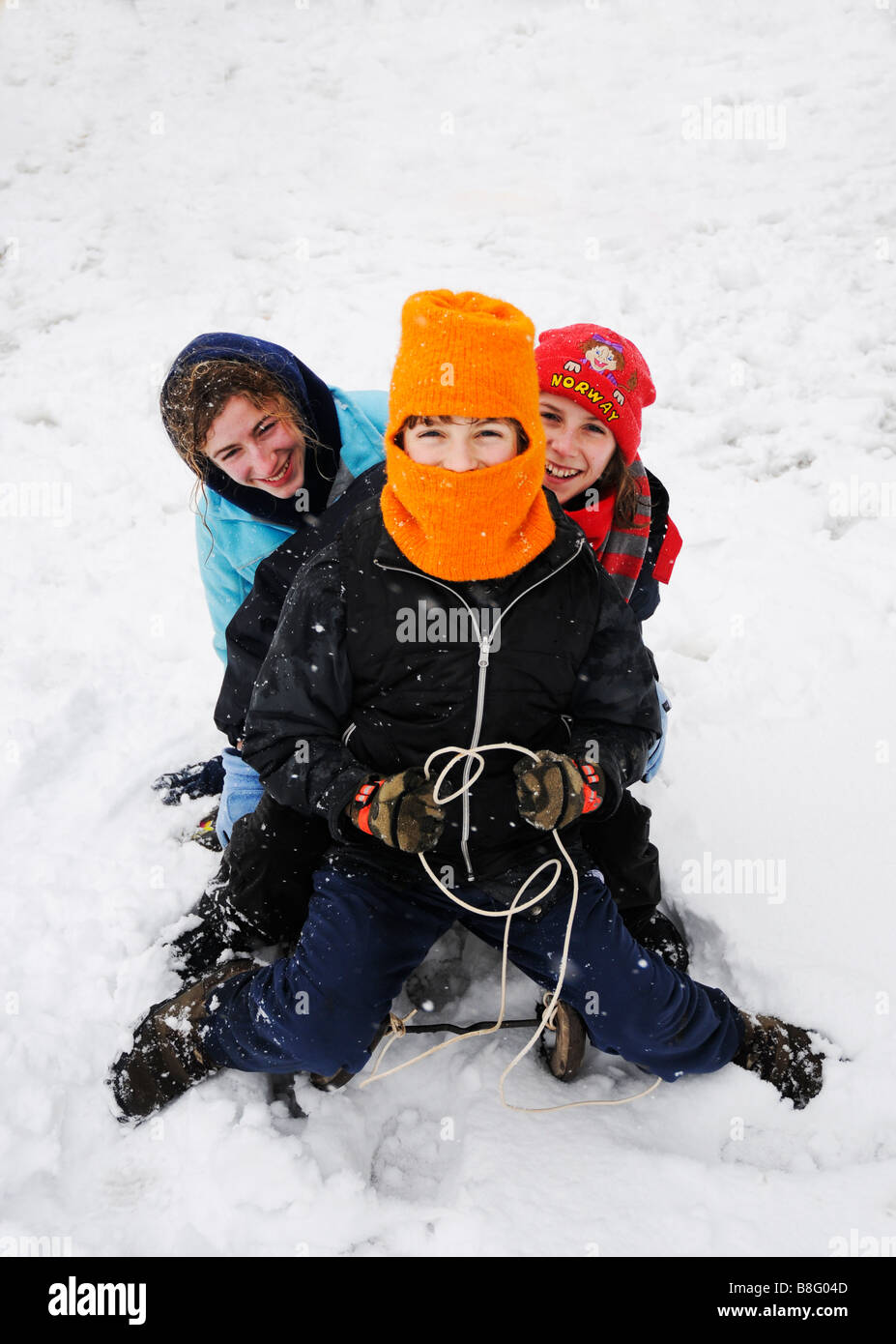 image of children laughing on sledge Stock Photo
