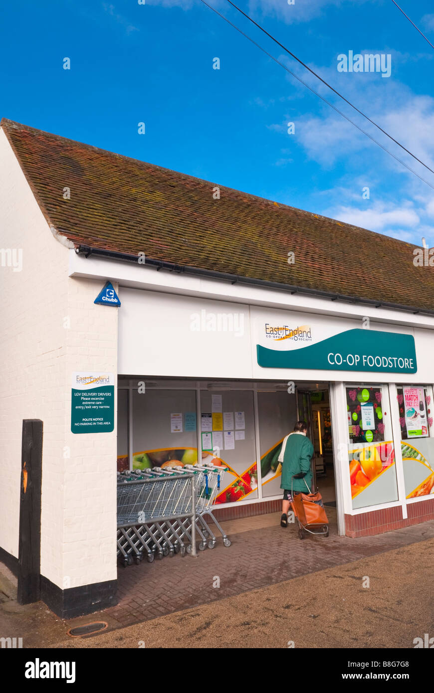 The Co-op foodstore shop store in Long Melford,Suffolk,Uk with customer entering shop Stock Photo