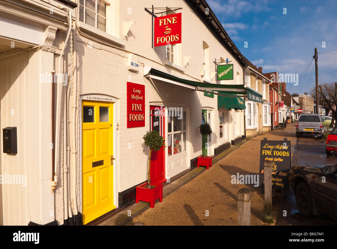 Shops including Long Melford Fine Foods along the main street in Long Melford,Suffolk,Uk Stock Photo
