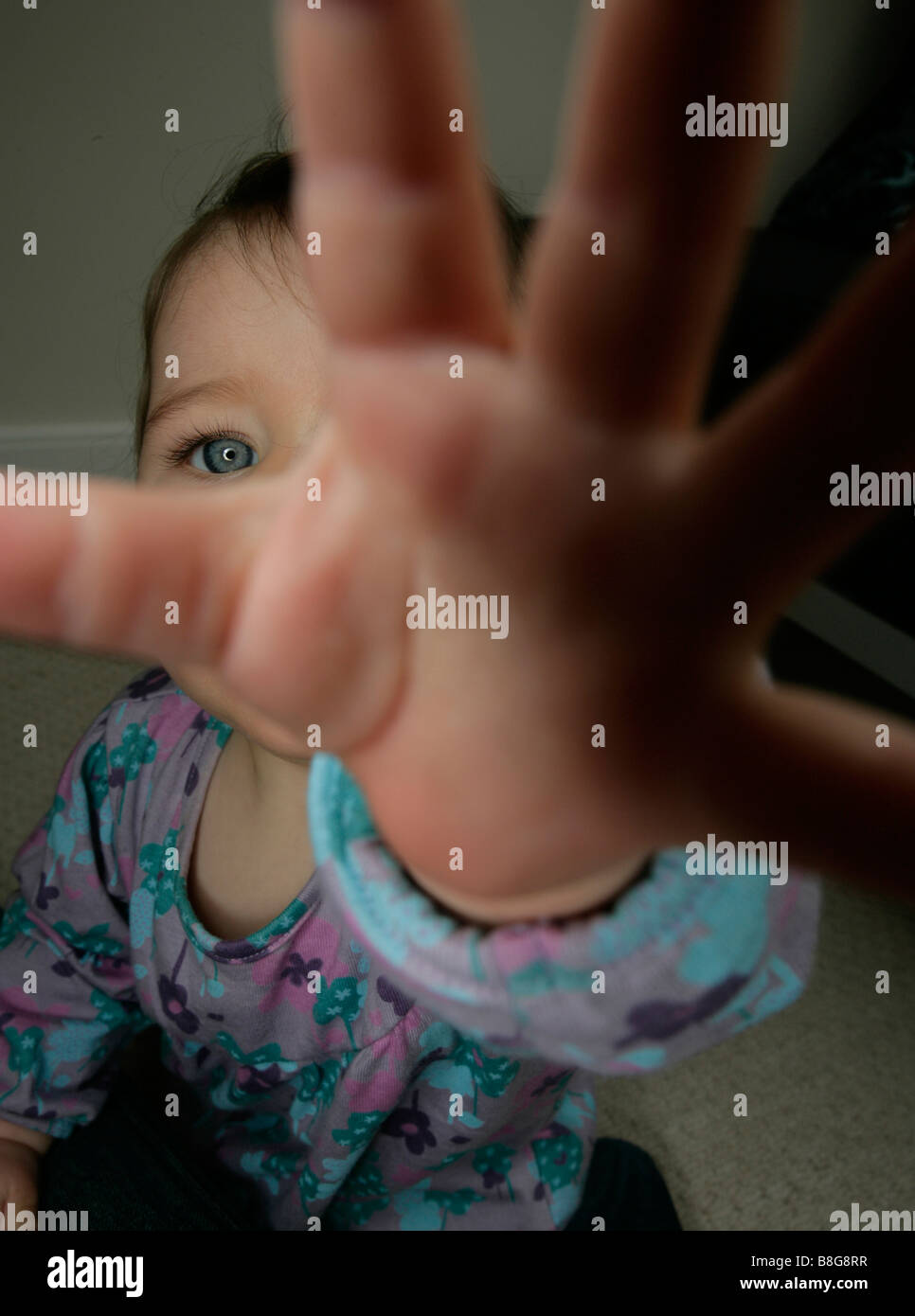 A baby girl grabbing Stock Photo Alamy