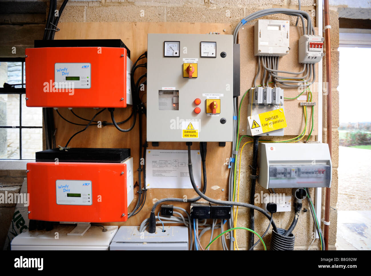 WIND TURBINE CONTROL BOX AND GRID INVERTERS IN AN ENERGY EFFICIENT HOME UK Stock Photo