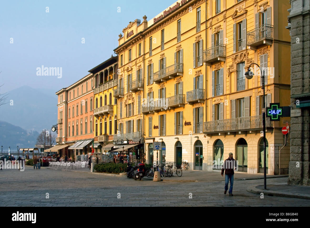 Apartment buildings shops and cafe near Lake Como Stock Photo Alamy