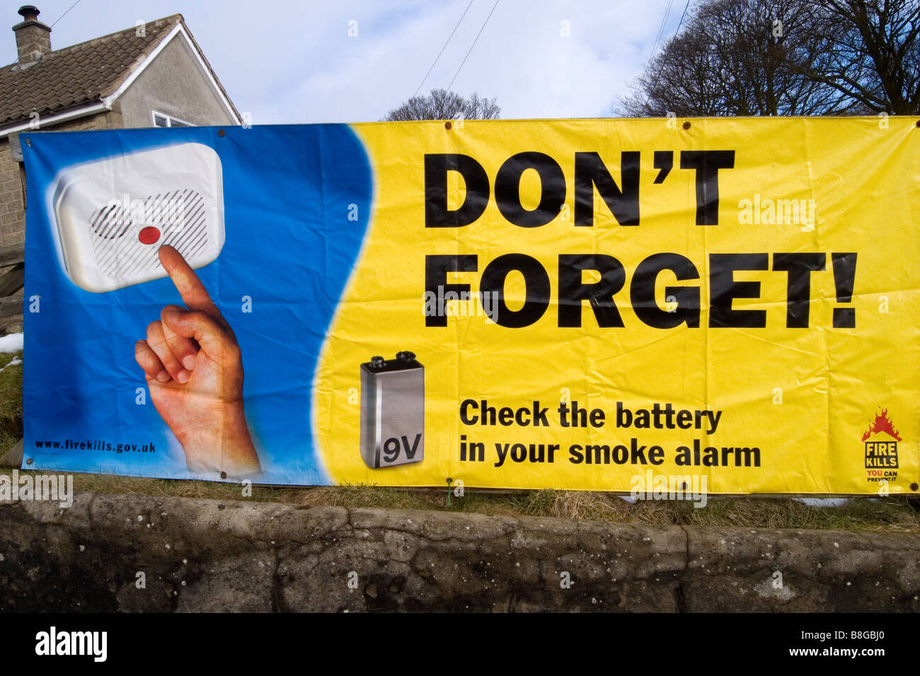 Government poster Don't forget check the battery in your smoke alarm Stock Photo