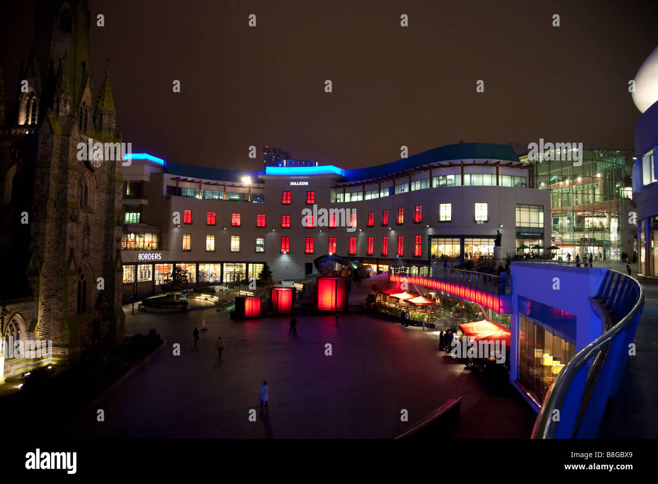 new shops and light display at night on cube fountains in Saint Martins