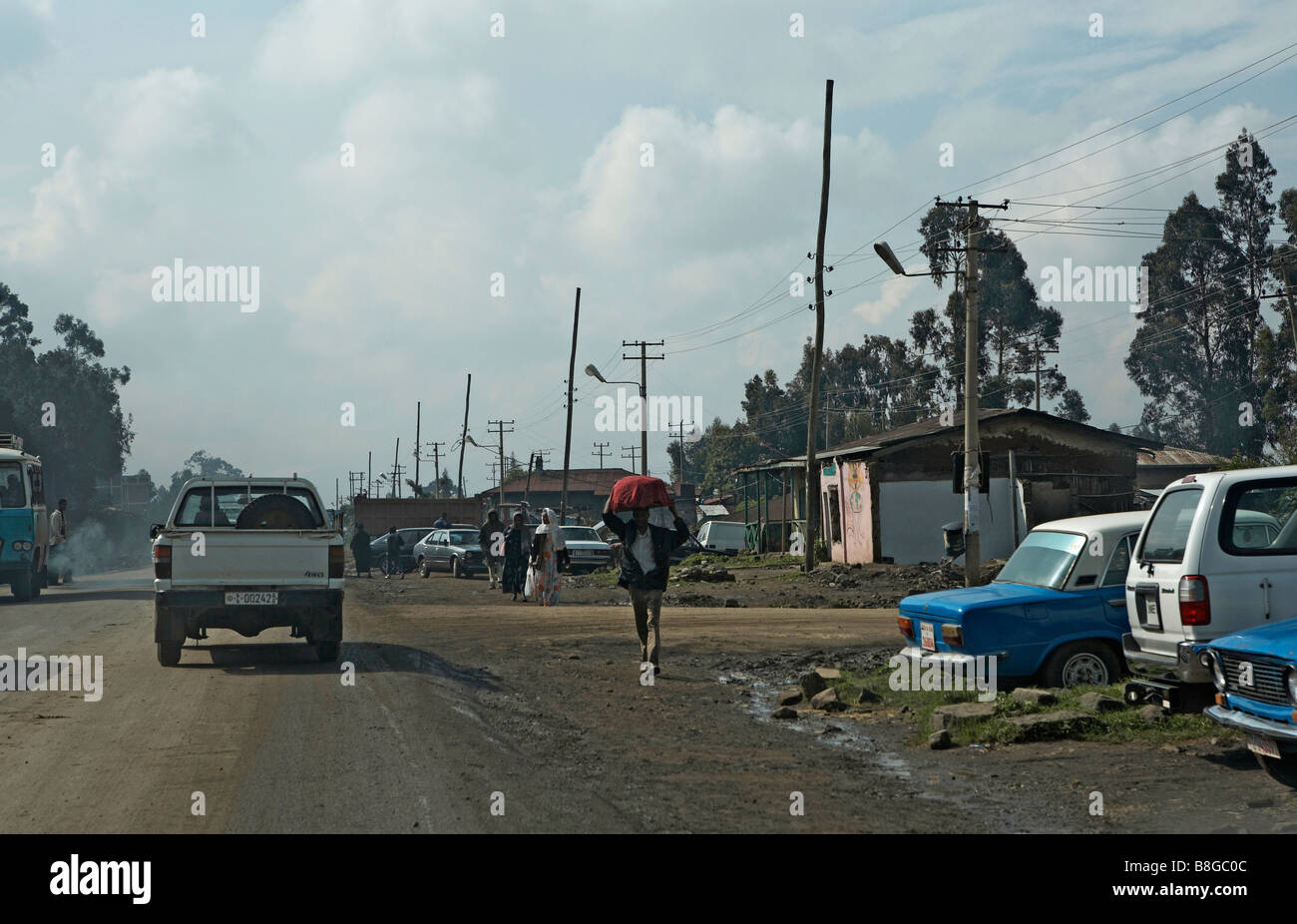 Addis Ababa Ethiopia taxis cars and huts by the roadside Stock Photo
