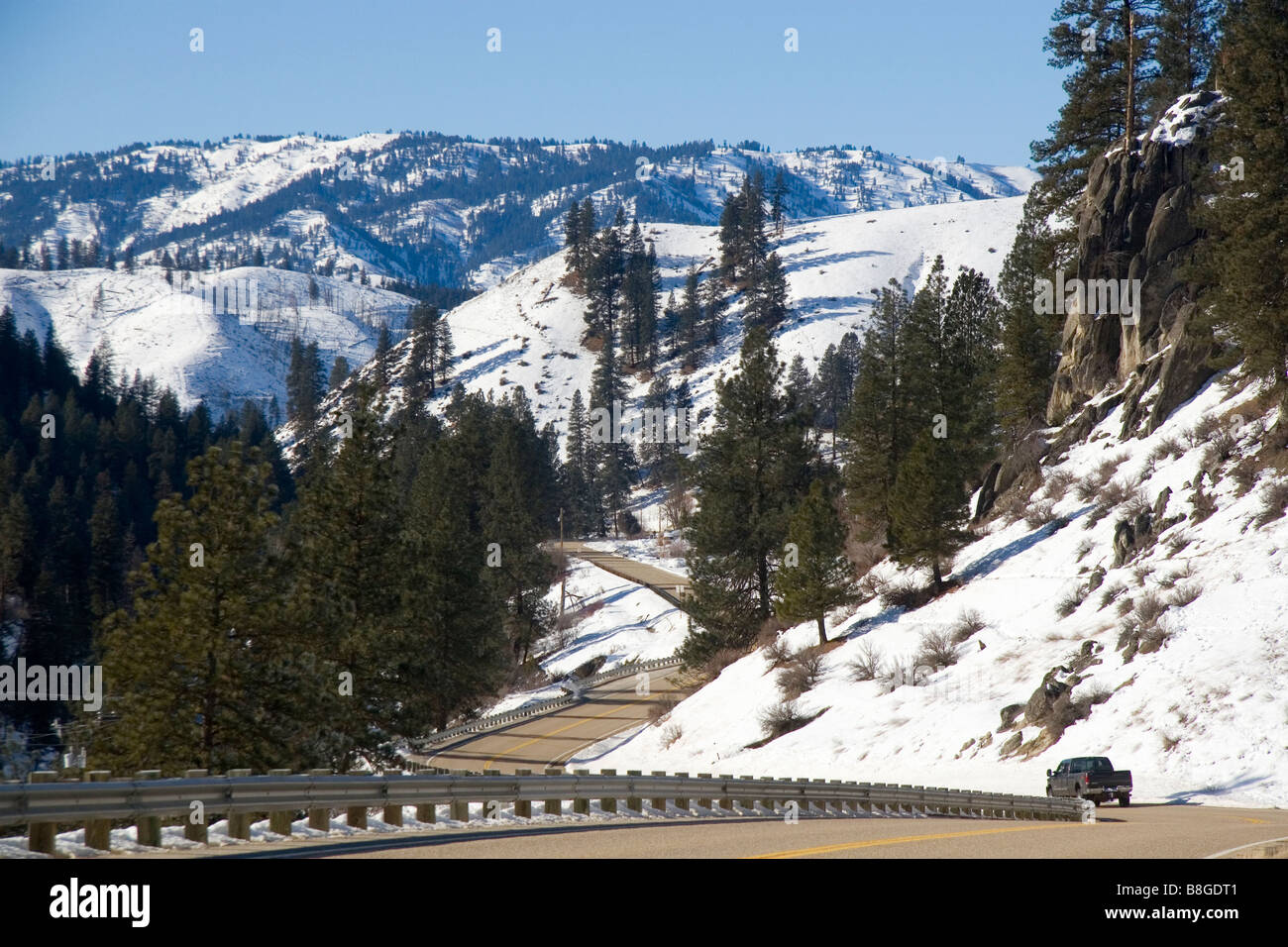 Truck traveling along South Fork of Payette River during winter in Boise County Idaho Stock Photo