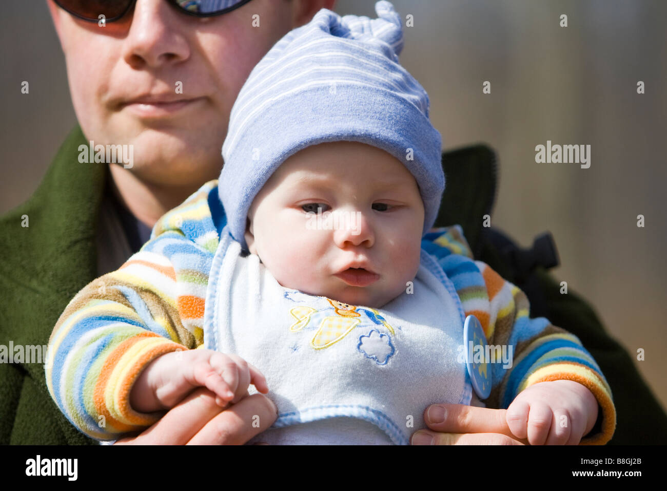 Proud father carrying baby boy Stock Photo Alamy