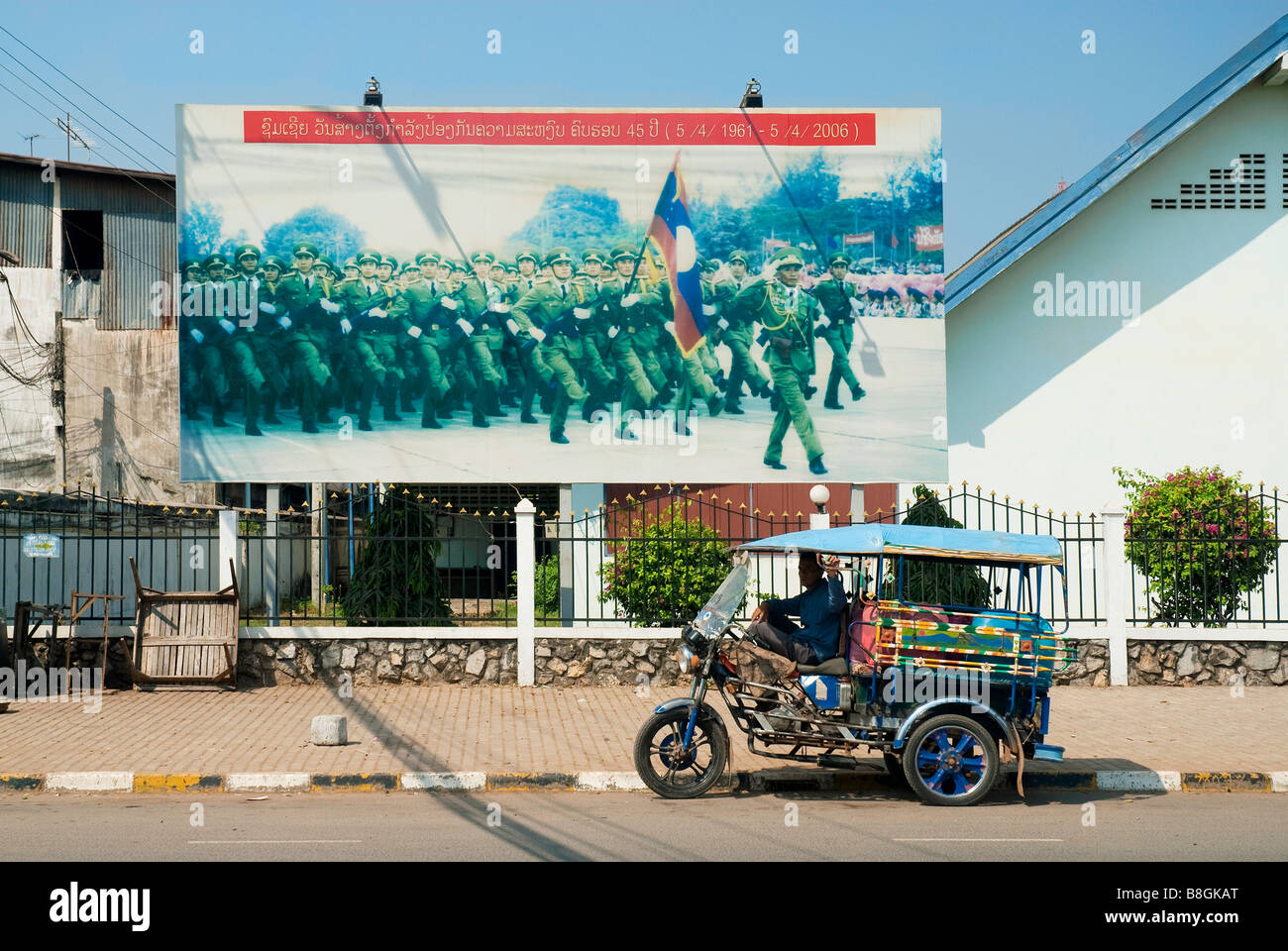 vientiane city laos asia street propaganda military political communist army with taxi Stock Photo