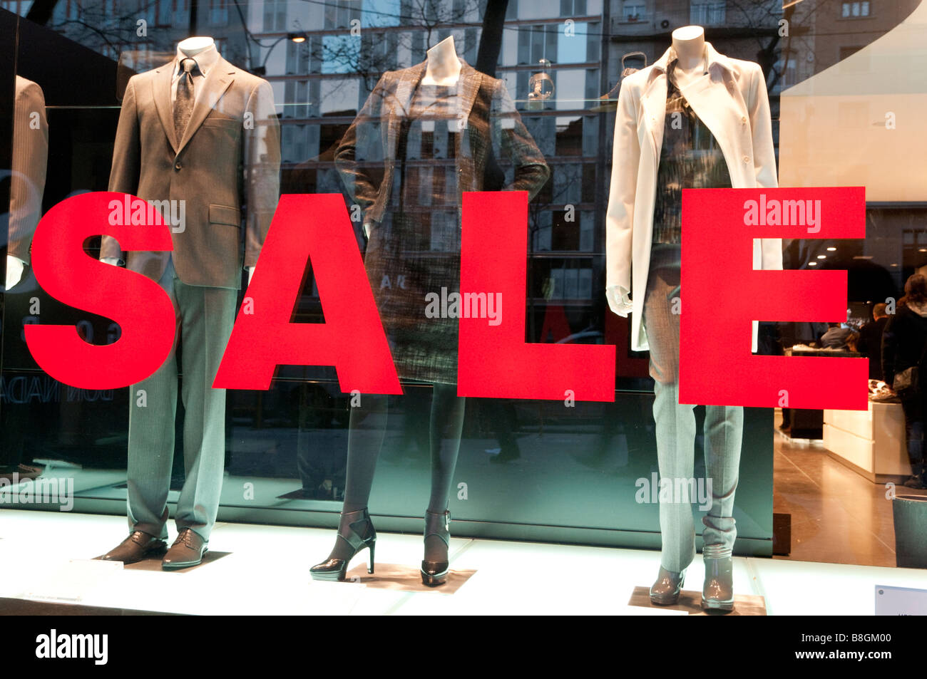 Big sales sign in shop window, Spain Stock Photo