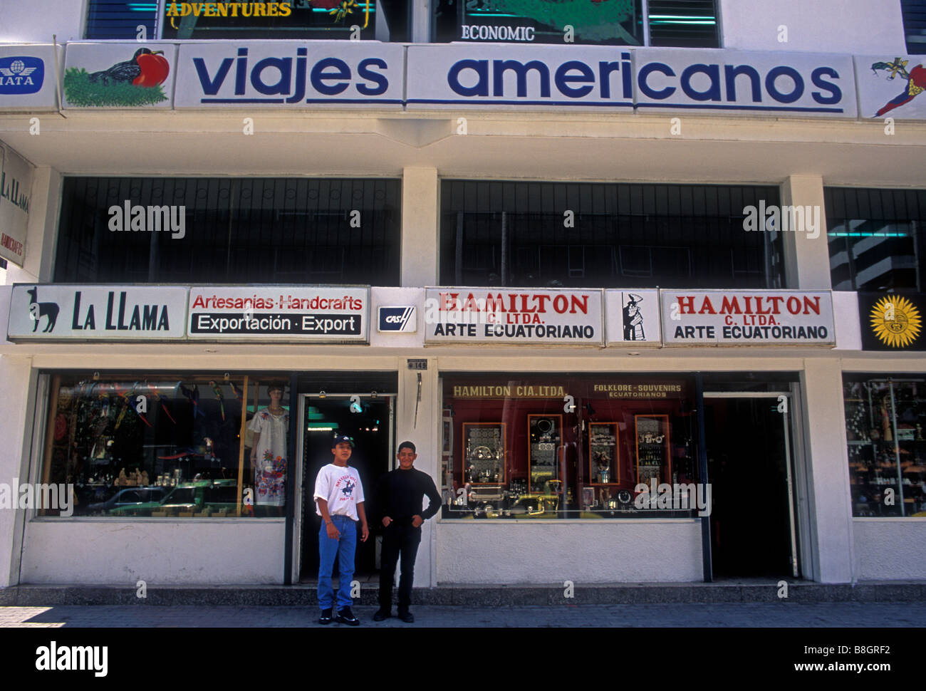 two Ecuadoran men, travel agency, art dealer, Avenida Amazonas, Quito, Pichincha Province, Ecuador Stock Photo