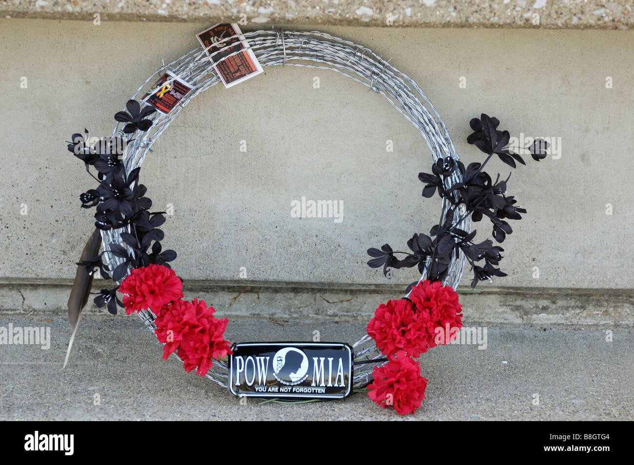 Barbed wire wreath laid at a Vietnam memorial in remembrance of ...