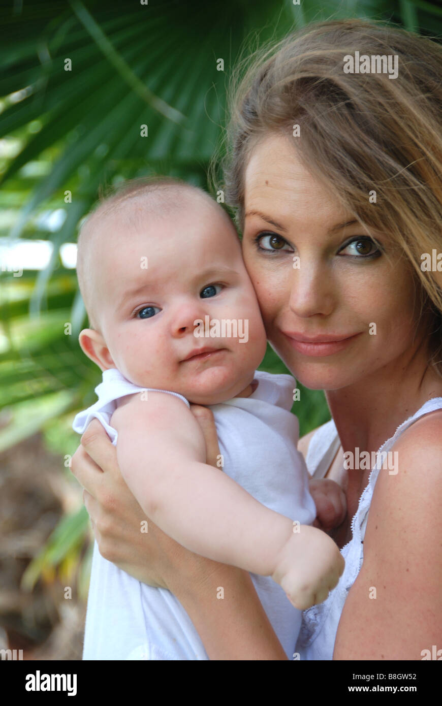 Mother lovingly holding her baby. Stock Photo