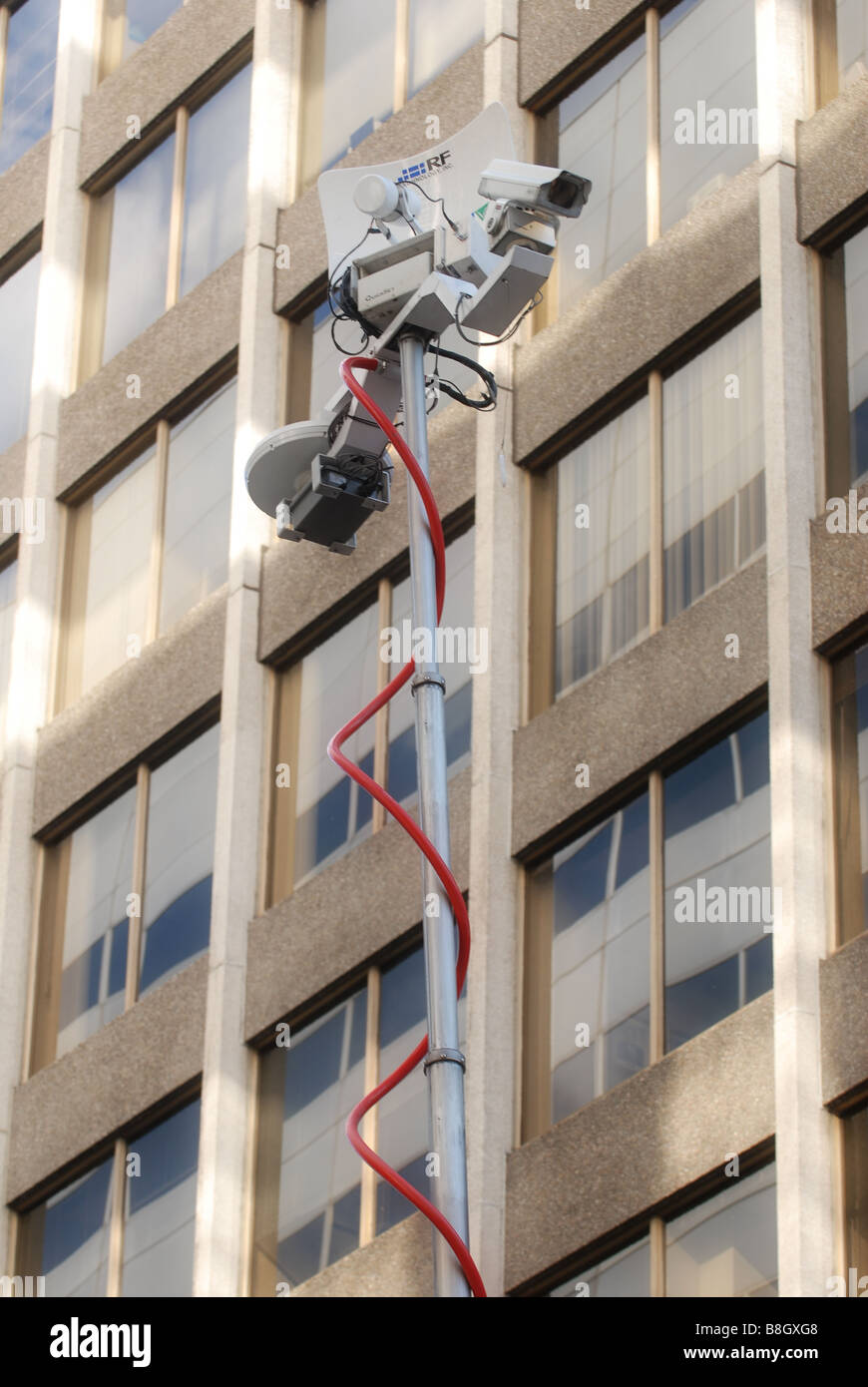 A news media antenna transmitting video feed on location from an event. Stock Photo