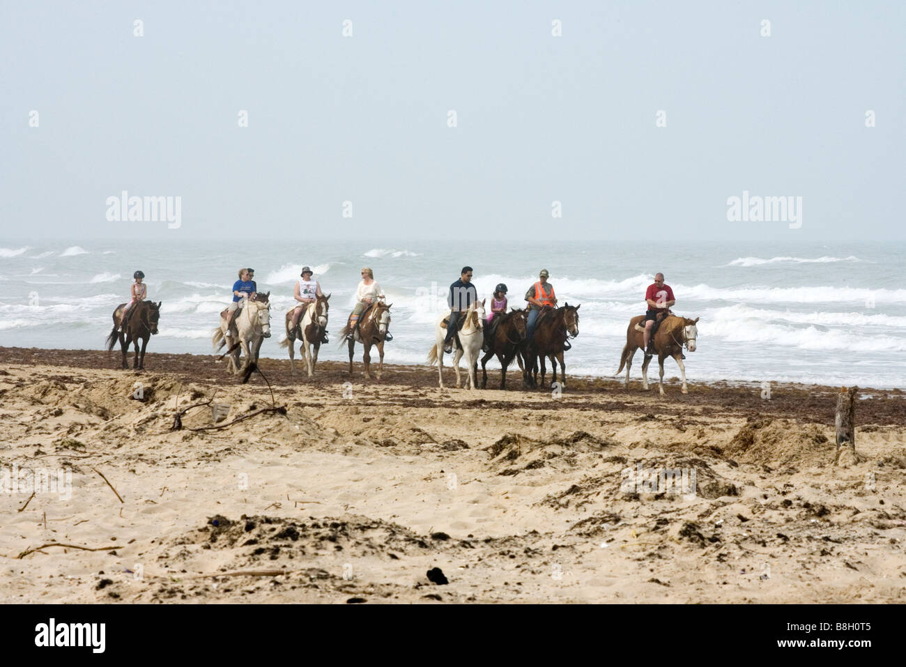 Horseback riders on beach South Padre Island Texas United States Stock Photo