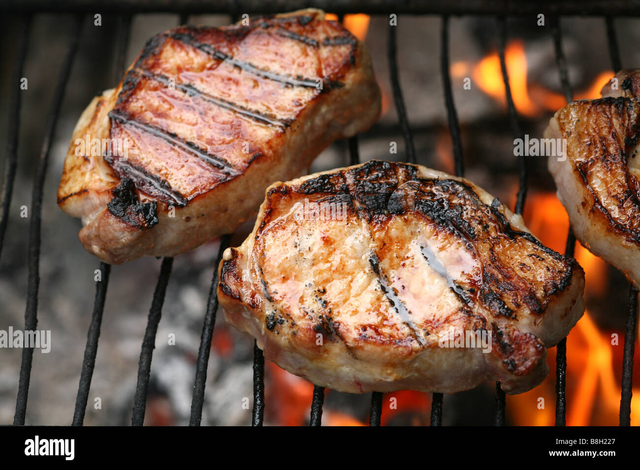 Bangalow Pork chops grilling over an open fire Stock Photo