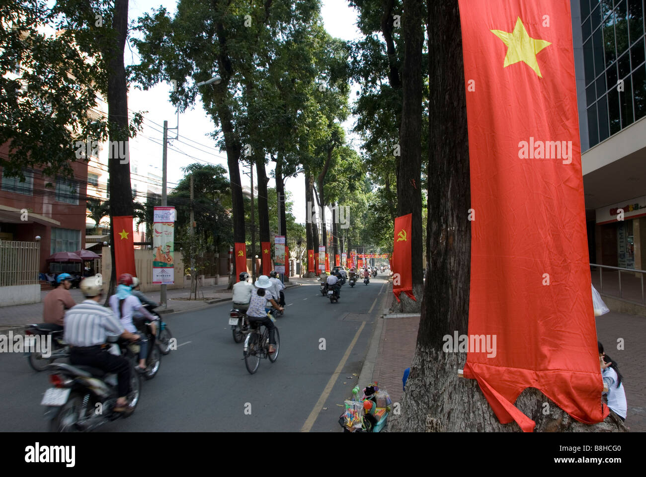 National flags hang in the street in Saigon, Ho Chi Minh City, Vietnam Stock Photo