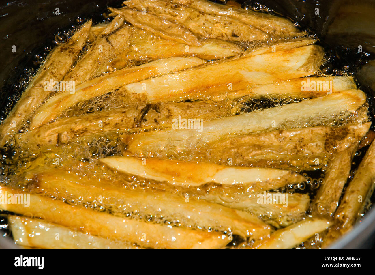 French Fries Cooking in Oil Stock Photo Alamy