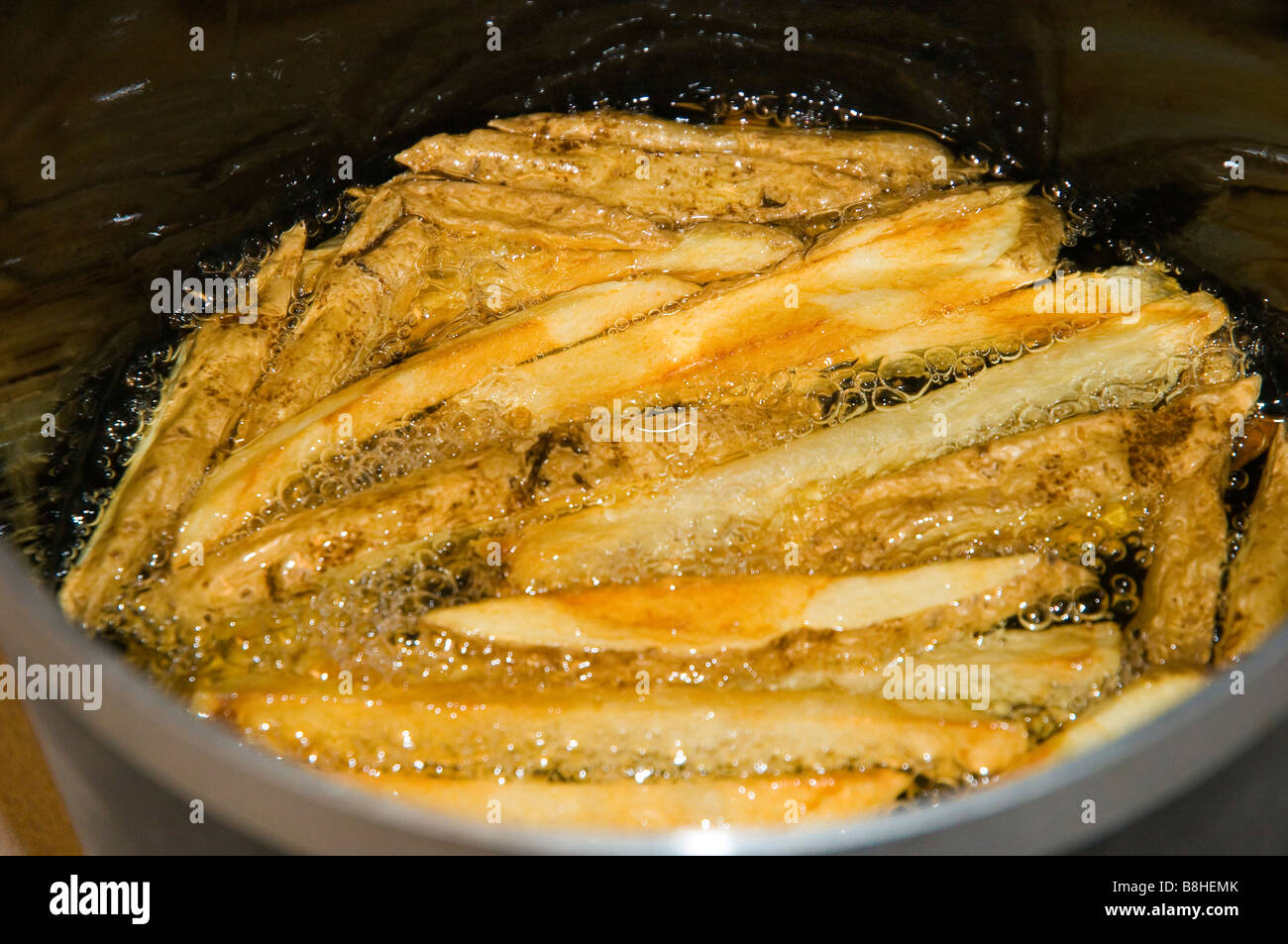 French Fries Cooking in Canola Oil Stock Photo Alamy