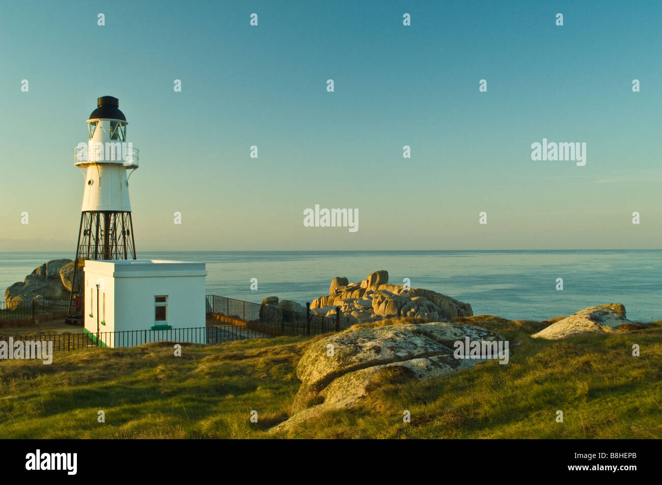 The lighthouse on Peninnis Headland on St Marys Scilly at dawn Stock Photo