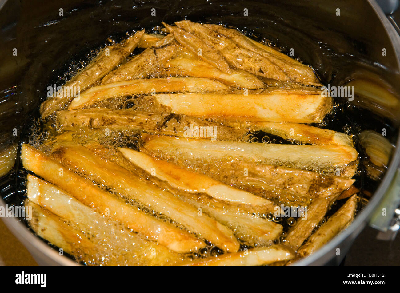 French Fries Cooking in Oil Stock Photo Alamy