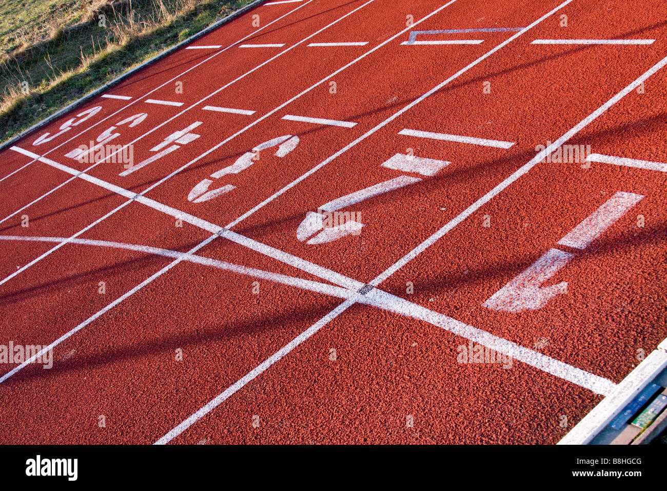 Lane numbers on running track Stock Photo Alamy