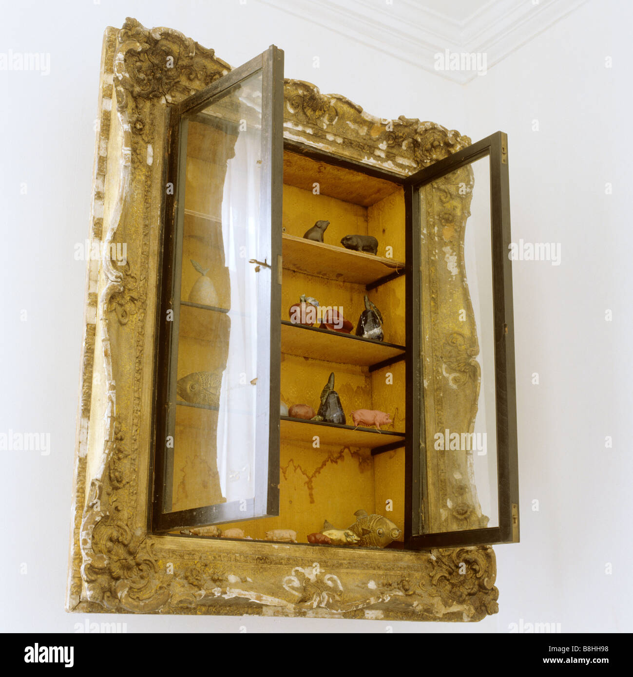 Recessed wall cabinet with an old picture frame around it Stock Photo