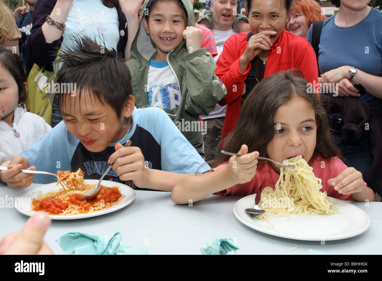 Children take part in a spaghetti eating contest Stock Photo